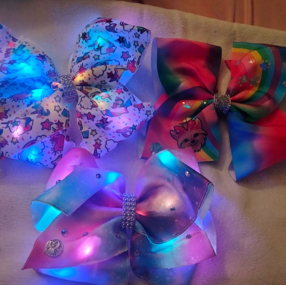 JoJo Siwa light up hair bows and non-light up hair bows.